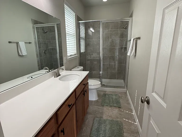 Master bathroom with NEW elongated toilet and NEW faucets...