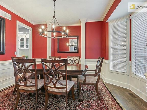 Dining Room with hardwood floors and great new light fixture
