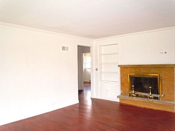 Alternate View of Living Room Showcasing Fire Place