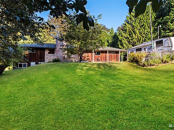 Paradise Found on 12.51 acres!  Large Rambler with Daylight Basement! Private, yet still close to it all.. town, shopping and freeway. >