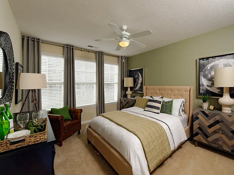 Bedroom with accent wall and carpet
