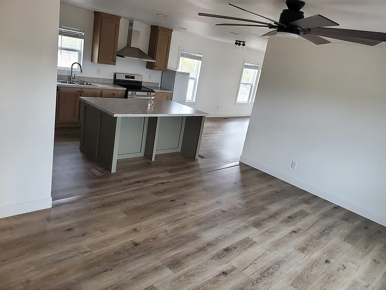 FRONT ROOM LEADING INTO KITCHEN