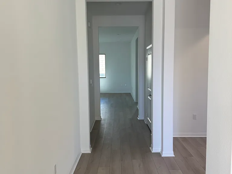 Long hallway leading to great room