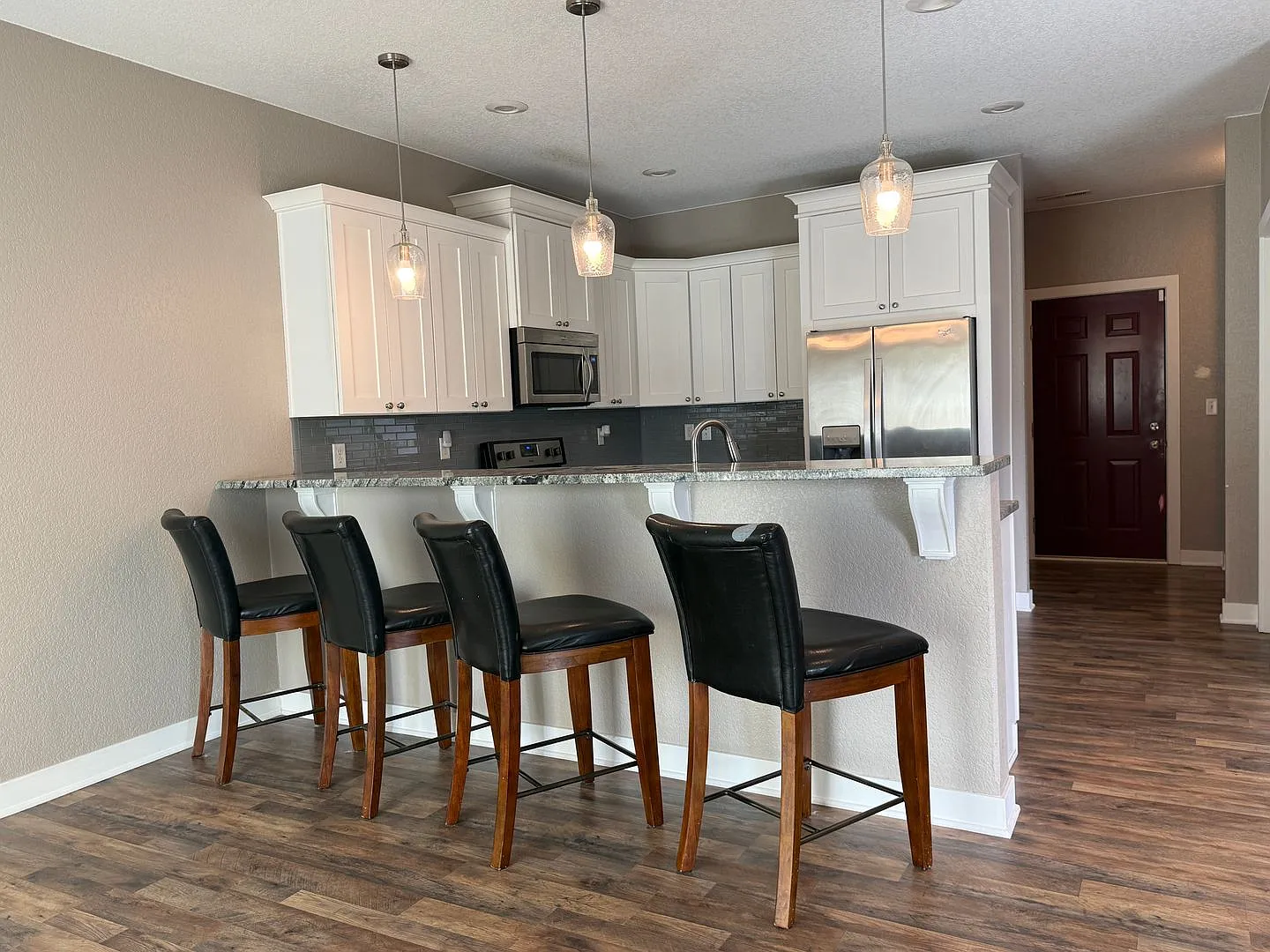 Spacious 4-Bedroom Twin Home | 3-Stall Garage + Fenced Yard — Photo 2