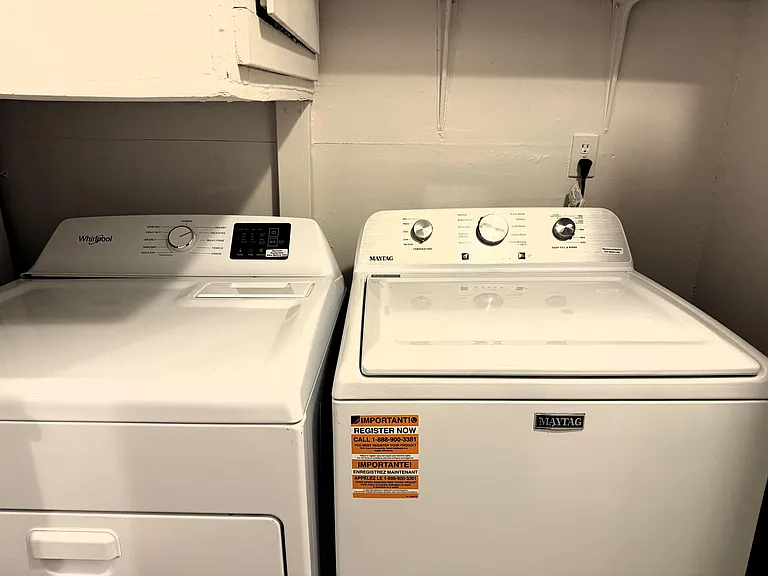 Dedicated laundry area with full-size washer and dryer for convenient in-home laundry.