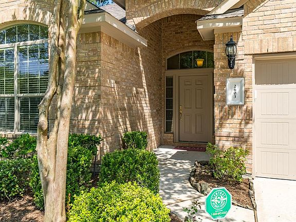 This DR Horton plan (2929 per seller) includes a covered front porch and carriage lights.