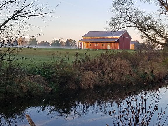 View of pole barn from woods
