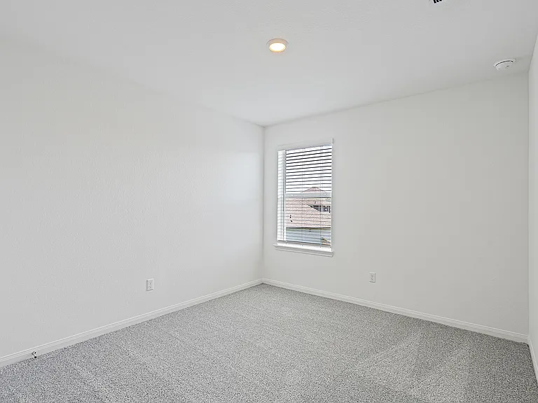 Each bedroom features lush carpet flooring.