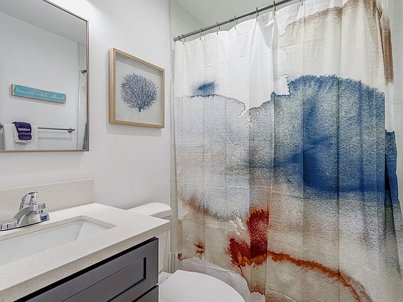 Main Bathroom, upstairs, with shower/tub combo.