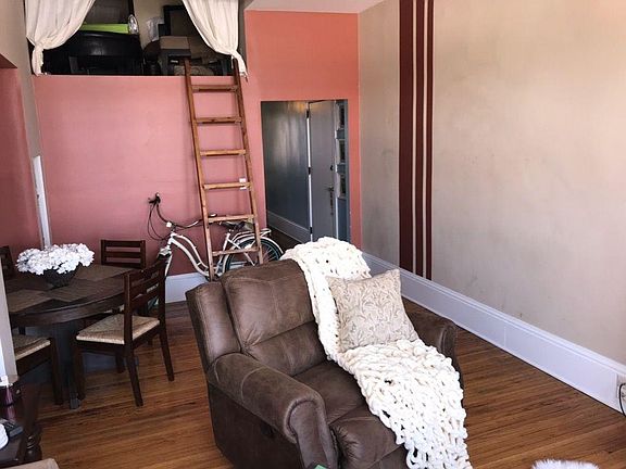 Large living room with space for dining table.  Loft space c