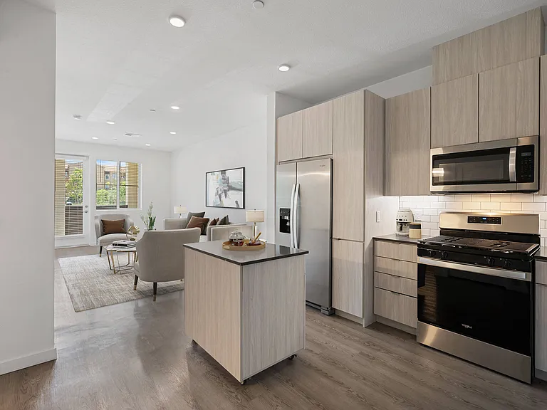 Unleash your inner chef in gourmet kitchens, featuring quartz countertops and a luxurious island for the ultimate cooking experience.
