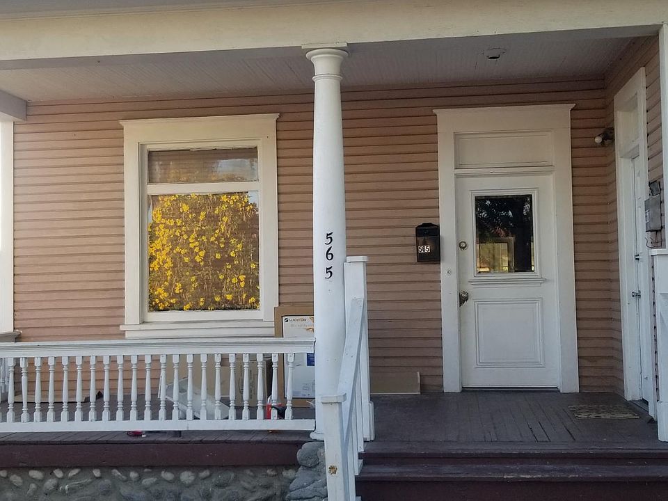 Front of the house with a porch.