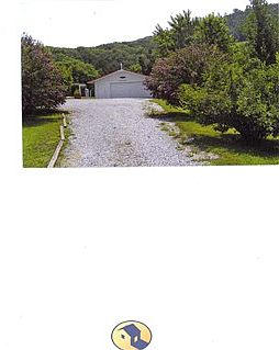Drive way back to house, garage and 2.11 acres at base of mtn
