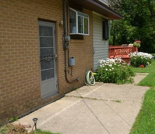 Between the house and the garage is patio area that leads to the side entrance and the backyard.  Great for bringing in groceries.