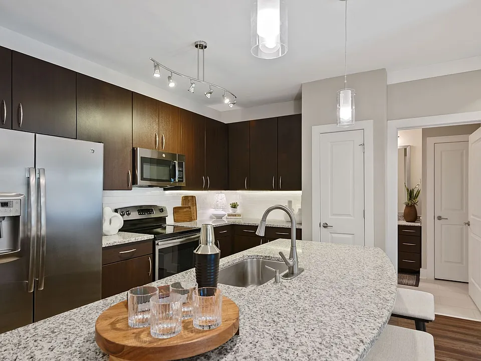 Kitchens with granite counters, subway tile backsplash and side-by-side stainless steel refrigerator with exterior ice/water dispenser