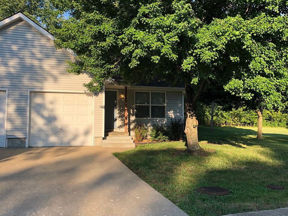 front of duplex with one car garage