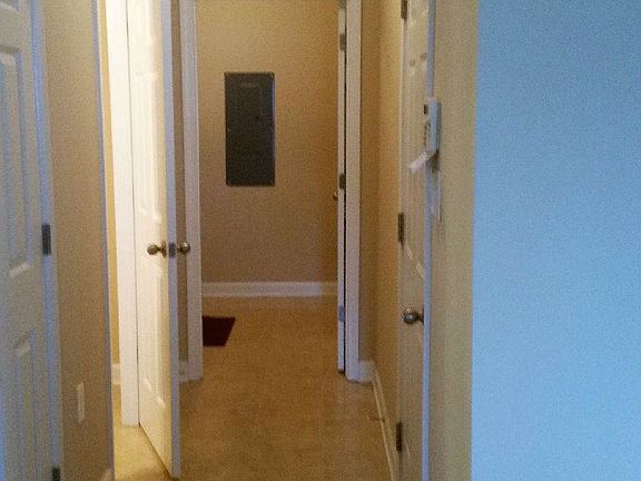 View to half bath laundry room and to garage