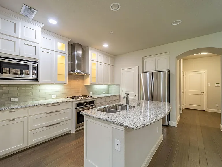 Center-island with breakfast bar and granite counters