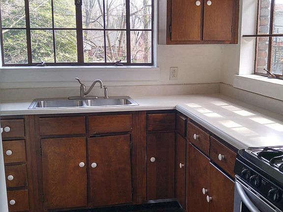 Kitchen features hardwood floors, new dishwasher, new refrigerator, gas stove, disposal.