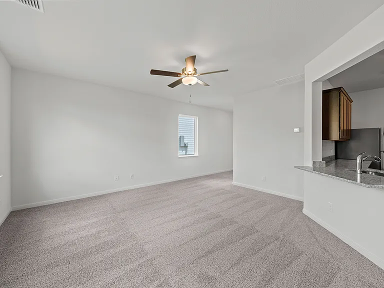 The spacious family room is perfect for family living and hosting.