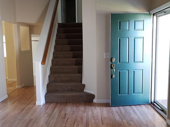 Living Room facing front door and upstairs