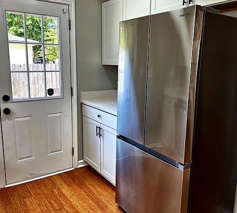 Samsung Refrigerator, door that leads to fenced in oversized yard.