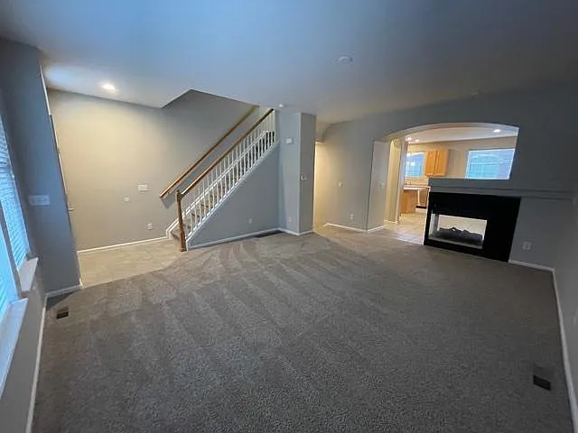 living room with 2 sided fireplace