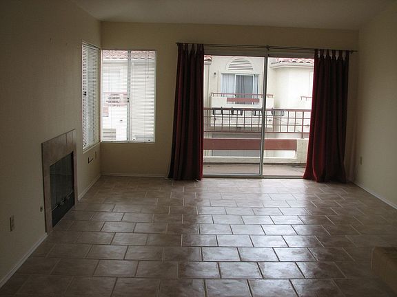 Living Room with balcony and fireplace