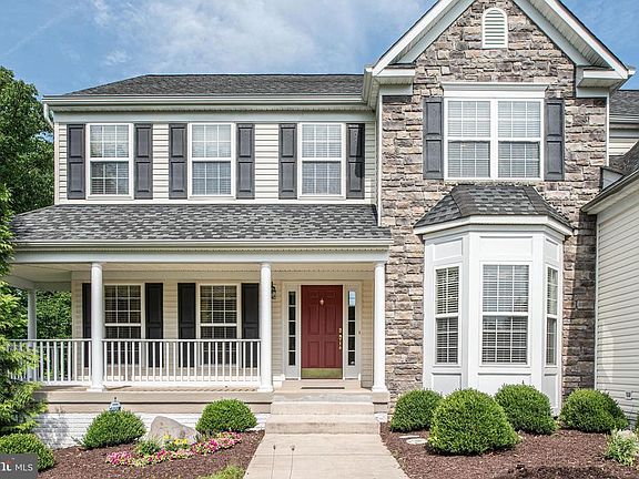 Wrap around porch, stone and siding exterior
