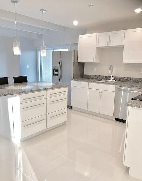 The Kay: 2BD / 1BA. All-new construction. Chef's kitchen. Double balconies. A work-at-home dream.