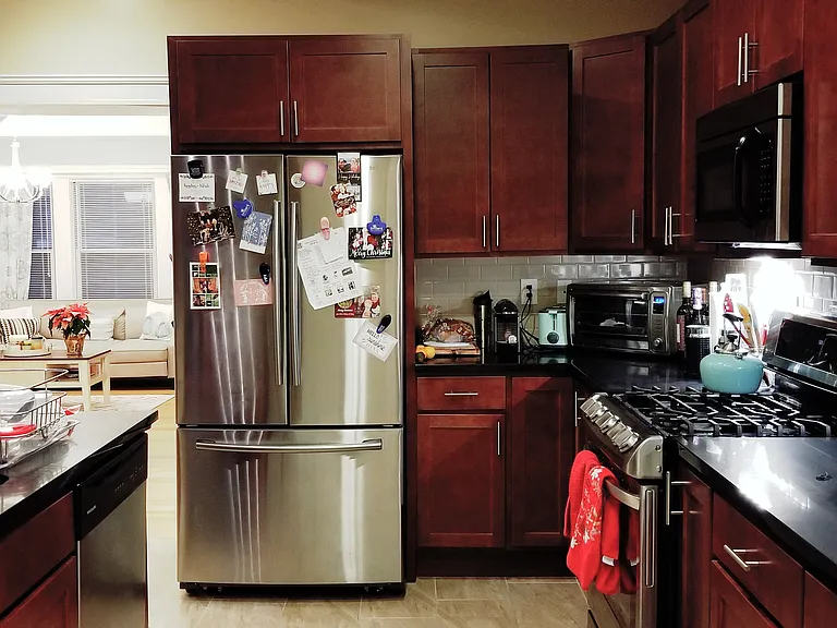 Kitchen with stainless steel appliances, including dish washer