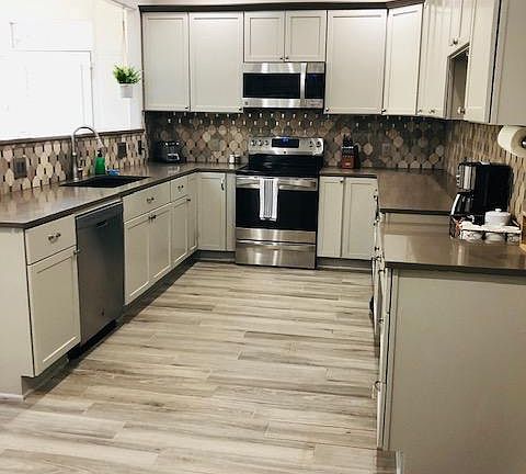 Updated modern kitchen with electric appliances.