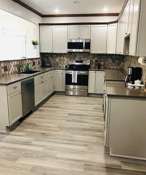 Updated modern kitchen with electric appliances.