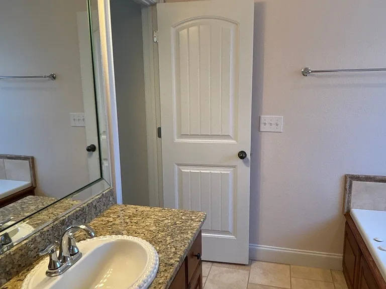Master bathroom with separate tub and shower