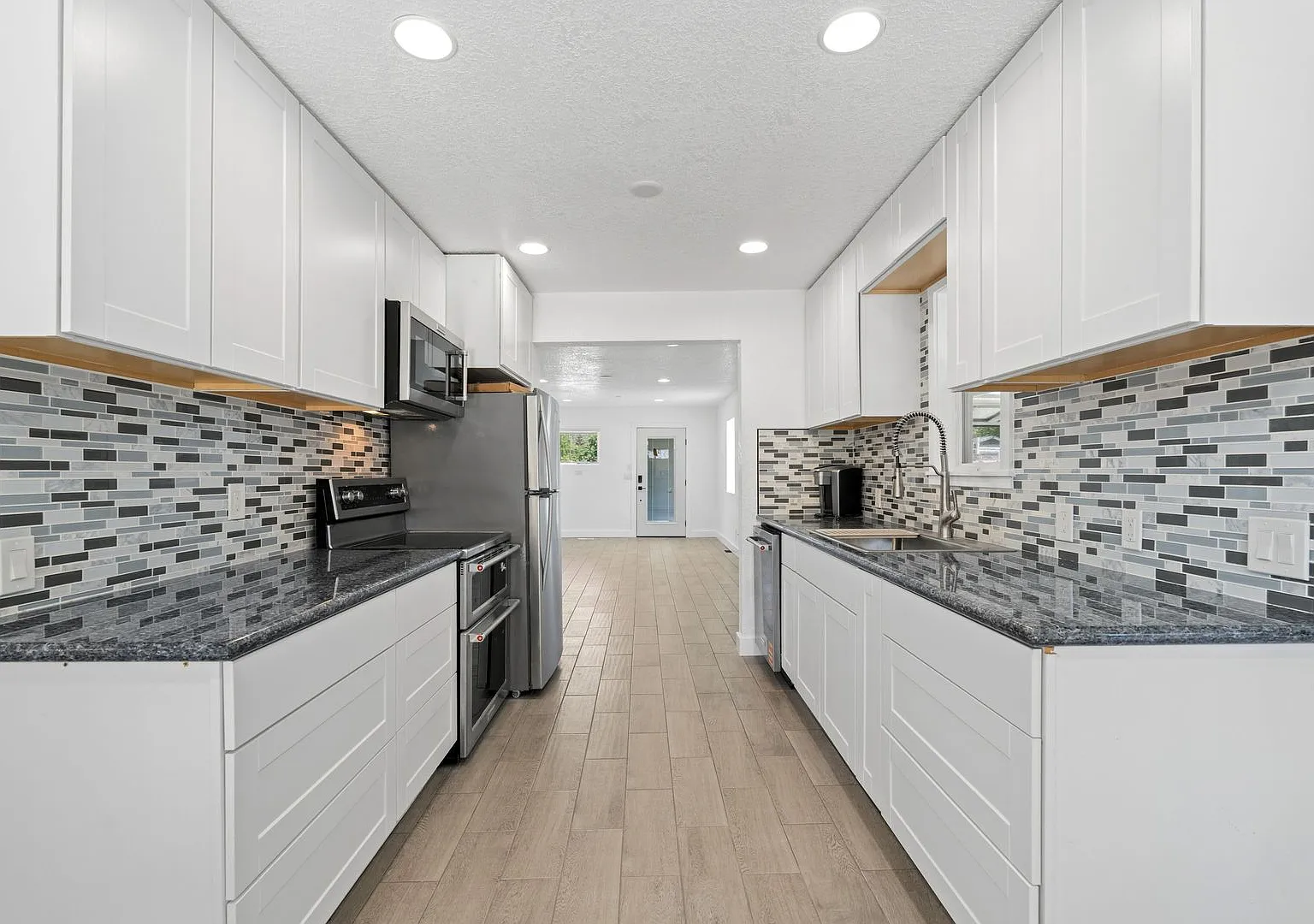 Complete Rebuild Modern Finishes 3 Bedroom 2 Bath Spokane Valley Home fenced backyard — Photo 3