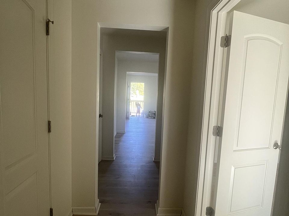 Hallway to room and bathroom two closets in the hall.