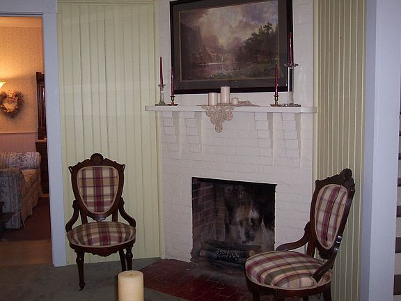Living room w/wood burning fireplace.