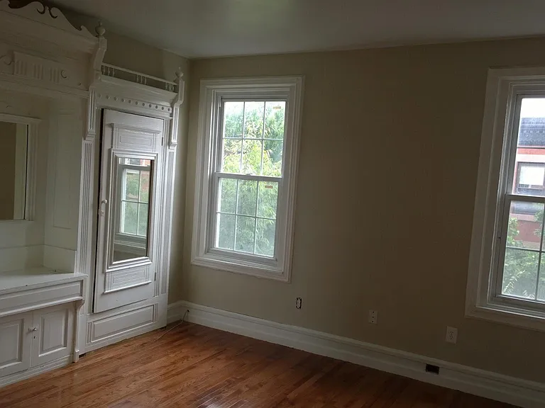 Bedroom with classical period built in wardrobe.