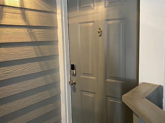 Well-lit private entryway w/ Wi-Fi enabled Smart Door Lock for keyless entry.
