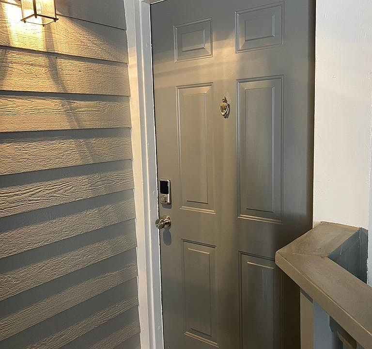 Well-lit private entryway w/ Wi-Fi enabled Smart Door Lock for keyless entry.