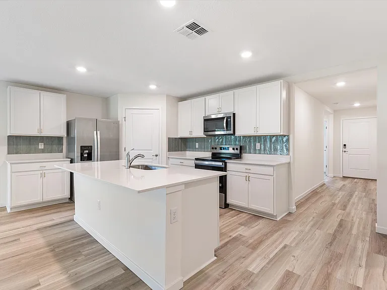 Kitchen with corner walk-in pantry