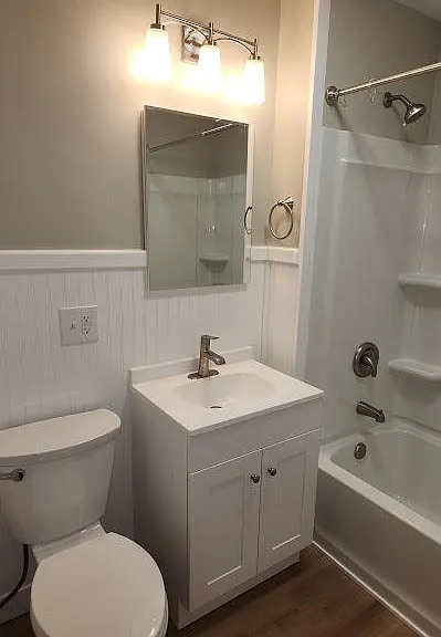 New Upstairs Bath, wainscoting, new tub/shower, Wi-Fi ceiling fan, new base & medicine cabinets, sink, faucet, toilet, lighting, luxury vinyl flooring.
