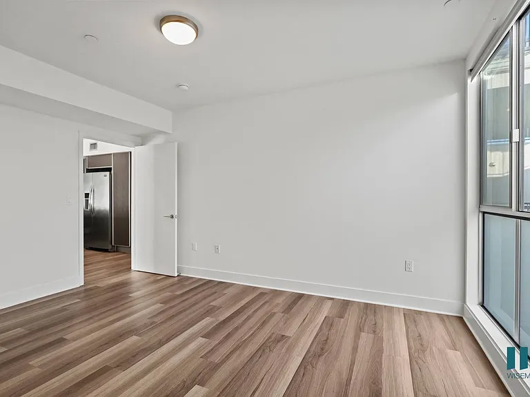 Bedroom with Large-Size Windows and Vinyl Flooring