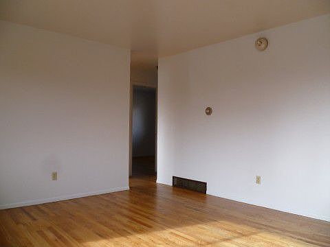 Beautiful Hardwoods in Sunny Living Room.