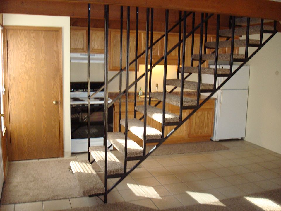 Kitchen with stove and refrigerator