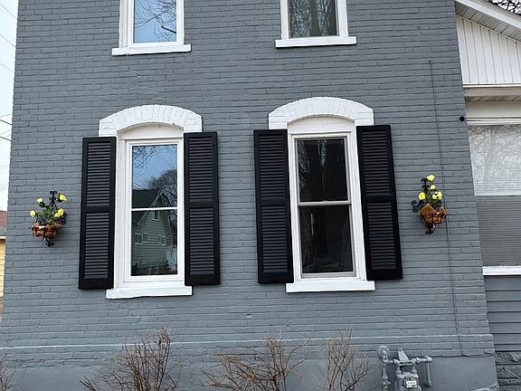 Road view of room showing 2 windows on main level for rent