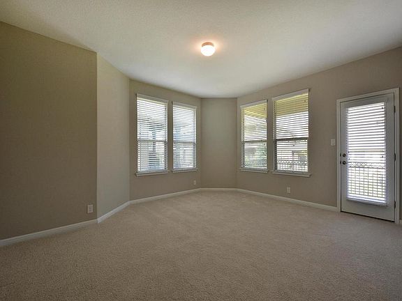 Large flex-room on second level! Walk-out to covered patio. Great for second living, in-home office, playroom etc.