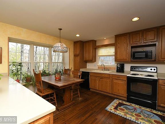 Eat-in Kitchen with large window for healthy plant