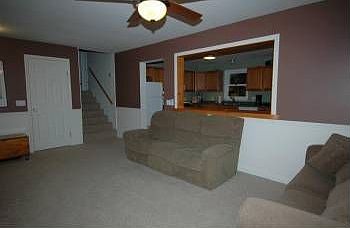 large bright living room with cutout from kitchen