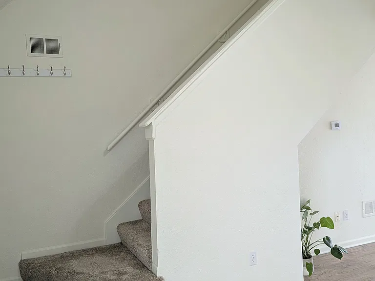 Stairs to bedrooms and full bath